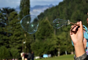man blowing bubbles