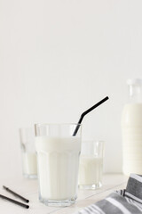 Fresh milk in a glasses with black straws, tasty healthy drink