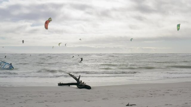 WS POV SLO MO People kiteboarding on sea / Livorno, Tuscany, Italy
