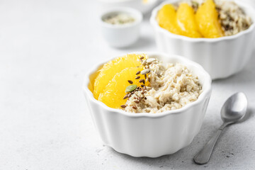 Overnight citrus oatmeal porridge. Selective focus, copy space.