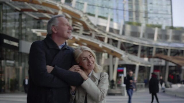 MS TS Smiling couple sightseeing in city / Milan, Italy