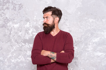 Hairstyle straight from runways. Bearded man with fashion hairstyle. Hipster with trendy facial hairstyle. Hairstyle trend. Barbershop. Hair salon. Male grooming products