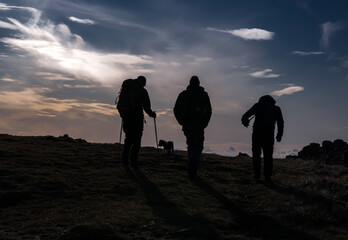 A silhouette of hikers,the Merrick, Galloway Forest Park, Scotland UK
