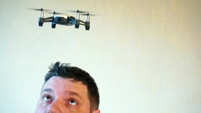 hobbies and entertainment.small four-engine drone flies indoors