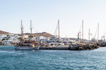 Fototapeta premium View of the spur and mooring of several sailboats and yachts on one of the islands of the Cyclades archipelago, Greece