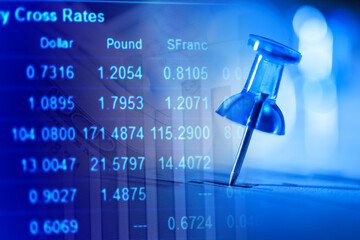 Close up of pin on graph data. Finance concept.