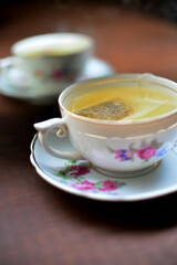 Cup of tea reflected in mirror