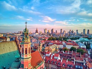 Fototapeta na wymiar Beautiful panoramic aerial drone view on Warsaw Old town (POL: Stare Miasto) with modern skyscrapers on the horizon, Royal Castle, square and the Column of Sigismund III Vasa at sunset, Poland