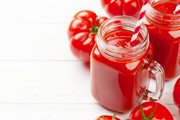 Fresh tomato juice and ripe tomatoes