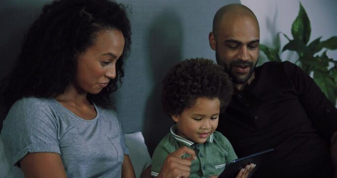 MS SLO MO Family with son (2-3) using tablet / Claremont, Cape Town, South Africa