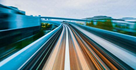 Abstract high speed technology POV train motion blurred concept from the Yuikamome monorail in Tokyo, Japan