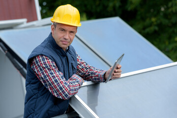 Fototapeta premium a man and the maintenance of solar cells