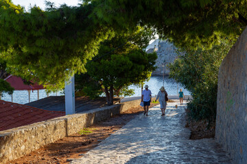 Amazing  morning  and Tourists going on greek island Hydra