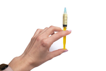 Syringe with medication in hand isolated on a white background. Medicine concept