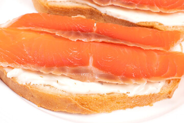 Sandwich with slices of red fish. Sliced Salmon. Food concept.