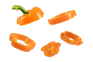 Orange flying pepper isolated on white background. Levitating paprika. Sliced floating pepper. Levity vegetable. Food concept.