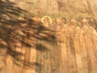 fresco on the wall of the monastery with images of saints