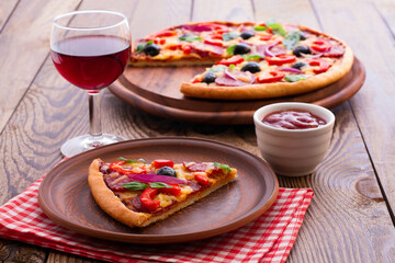 Delicious pizza served on wooden table