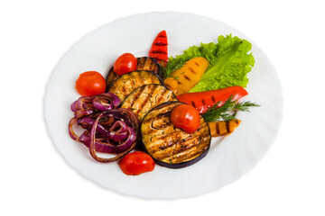Vegetable salad on white plate with grilled eggplant, cherry tomatoes, red and yellow bell peppers, purple onions, dill, lettuce leaf.
