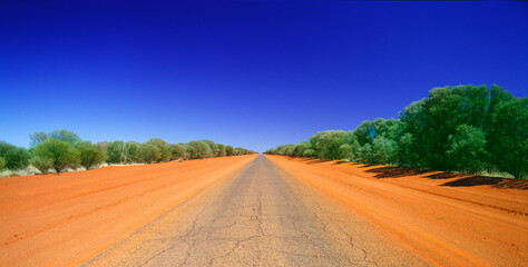 Long dusty desert outback road