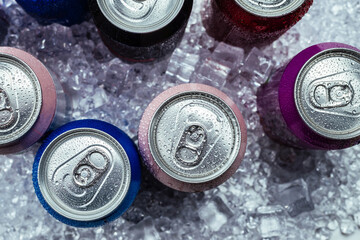 Group of aluminium cans in ice, cold drink.