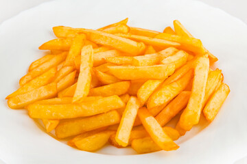 Fototapeta na wymiar French fries on a plate, isolated on white background