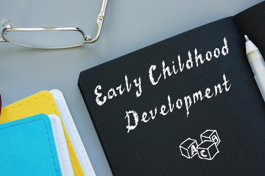 Educational Concept Meaning Early Childhood Development With Sign On The Sheet.