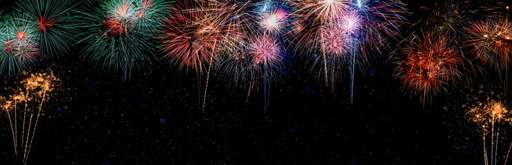 Colorful holiday festival celebration fireworks in Happy New Year 2023 with blank copy space for banner.