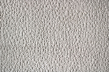 Soft popcorn ceiling texture of a wall in white color - embossed surface background