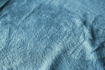 blue velvet texture from a wrinkled blanket - background wallpaper image for fragility and delicacy feeling