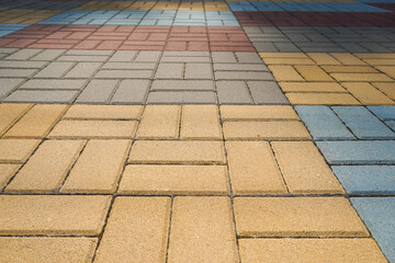 Stone pavement in perspective. Stone pavement texture. Granite cobblestoned pavement background....