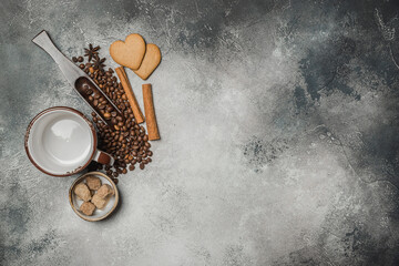 Top view of a Cup of coffee, cappuccino on a table with coffee beans with a wooden spoon