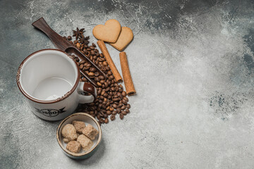 Top view of a Cup of coffee, cappuccino on a table with coffee beans with a wooden spoon