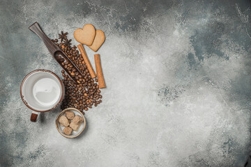 Top view of a Cup of coffee, cappuccino on a table with coffee beans with a wooden spoon