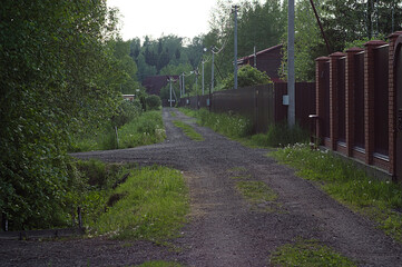 dacha village street in the summer evening