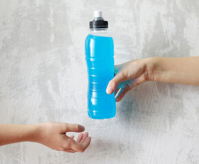 Isotonic energy drink in hand