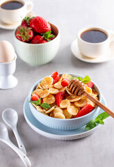 Blue Bowl for breakfast with Pancake cereals with strawberries.