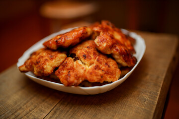 Homemade chicken cutlets. The plate is full of delicious chicken meatballs prepared for food. Fried...