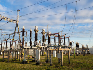 High voltage power substation. 110 kV devices. Blue sky background