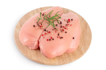 Fresh chicken fillet with rosemary on wooden board isolated on white background with clipping path and full depth of field.