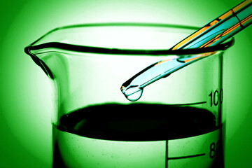 Pipette and laboratory glass. Science concept.