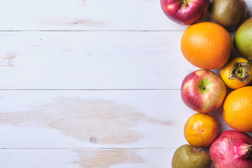 Fruit on a white table. Place for text.