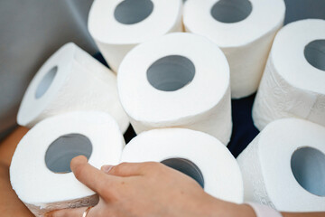 People are stocking up toilet paper for home quarantine from coronavirus.