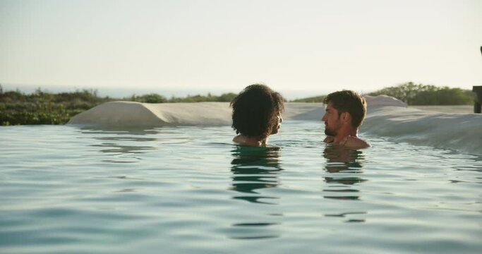 WS Couple swimming in pool / Claremont, Cape Town, South Africa