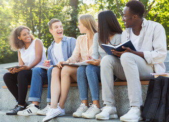 Close up of friendly group of students studying outdoors