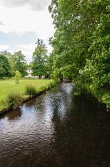 Fototapeta na wymiar Morden, London, England, United Kingdom - 9 June 2015: The River Wandle is a tributary of the River Thames running from Surrey to Wandsworth