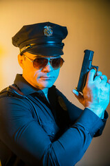 angry cop with gun in hand, police officer  