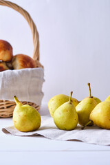 Homemade rustic granny pears on a white wooden table. Rural still life.