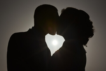 silhouette of bride and groom heart shape.