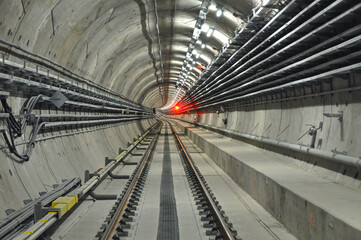 Metro tunnel (subway or underground) with precast concrete linings (segments or rings) with a red...
